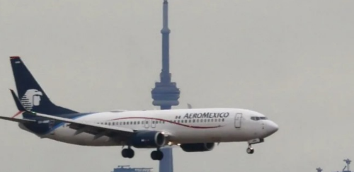 Aeromexico passenger opens plane door and walks on wing